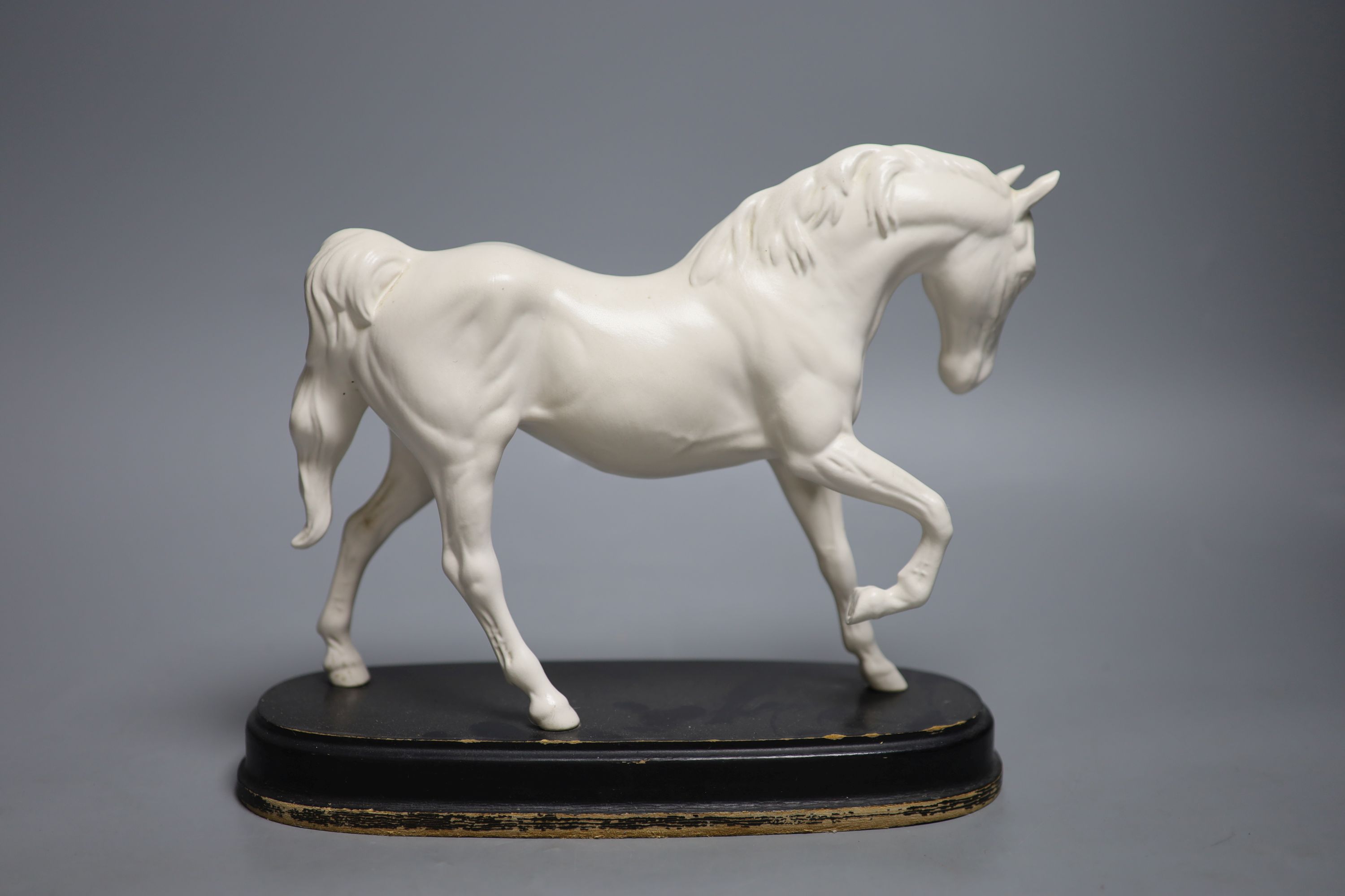 A Doulton silicon Lambeth planter, A Royal Doulton ‘Spirit of Freedom’ horse and a figural porcelain casket